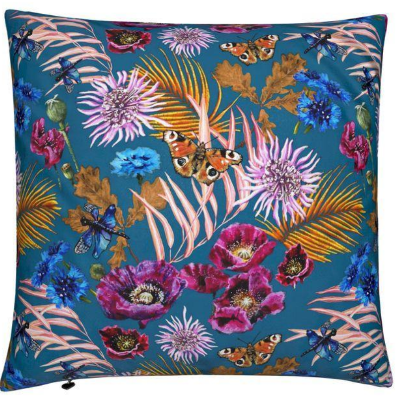 Decorative pillow with floral and butterfly pattern on a blue background
