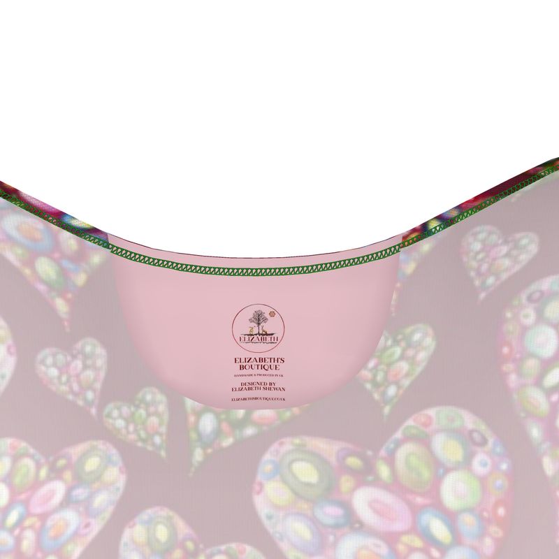 cotton Pink label dress with colorful heart and soul patterns and a brand logo of Elizabeth's Boutique on a white background