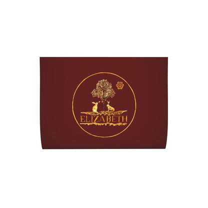 Maroon logo label with gold yellow print design featuring two hares under a tree, with 'Elizabeth' written below logo for Elizabeth's Boutique artist Elizabeth Shewan