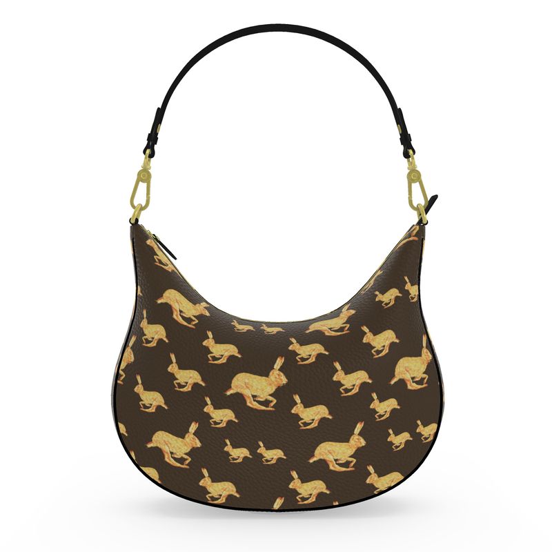 Handbag with gold rabbit pattern on brown background