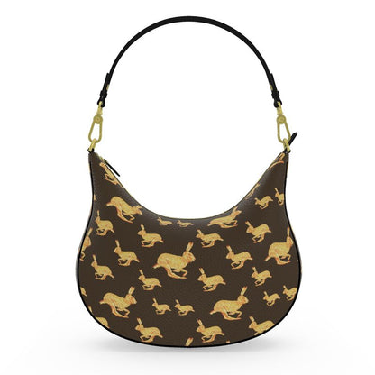 Handbag with gold rabbit pattern on brown background