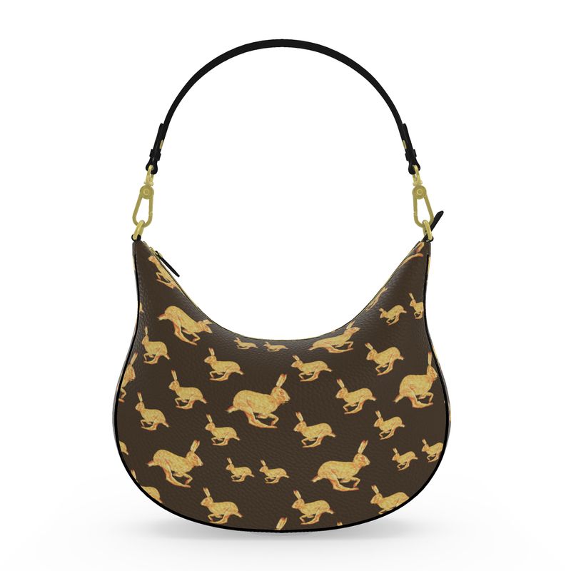 Handbag with gold animal pattern on a brown background
