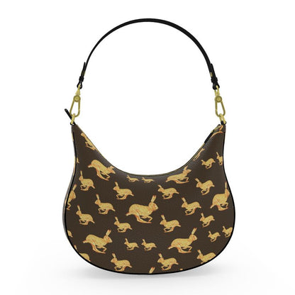 Handbag with gold rabbit pattern on a brown background