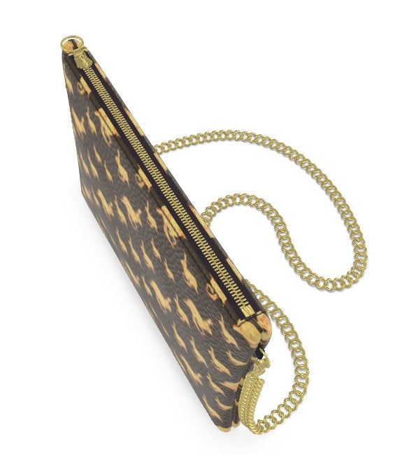 Clutch bag with animal print and gold chain strap on a brown background