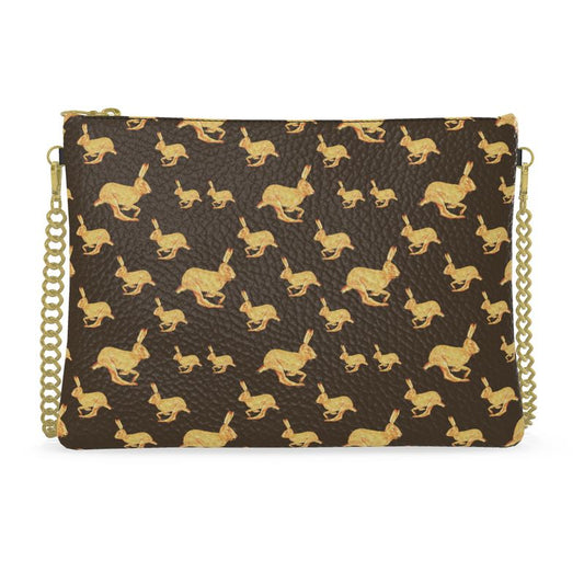 Clutch bag with gold rabbit pattern on a brown background