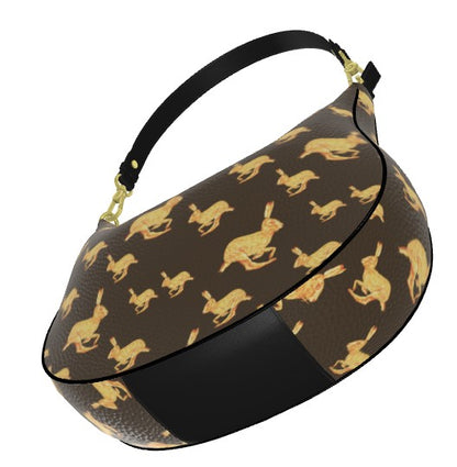 Black handbag with gold animal pattern on a white background