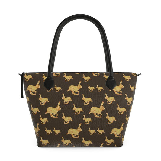 Handbag with gold rabbit pattern on brown background