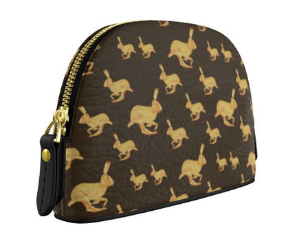 Cosmetic bag with gold rabbit pattern on brown background