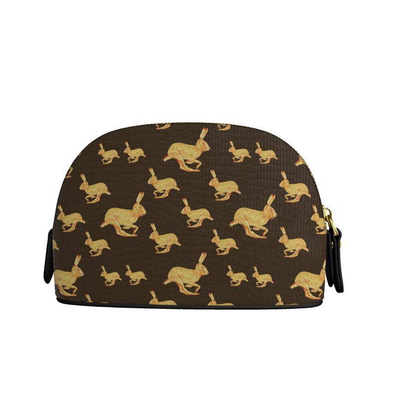 Cosmetic bag with gold rabbit pattern on brown background