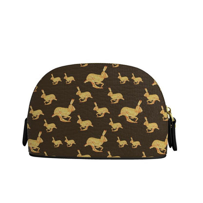 Cosmetic bag with gold rabbit pattern on brown background