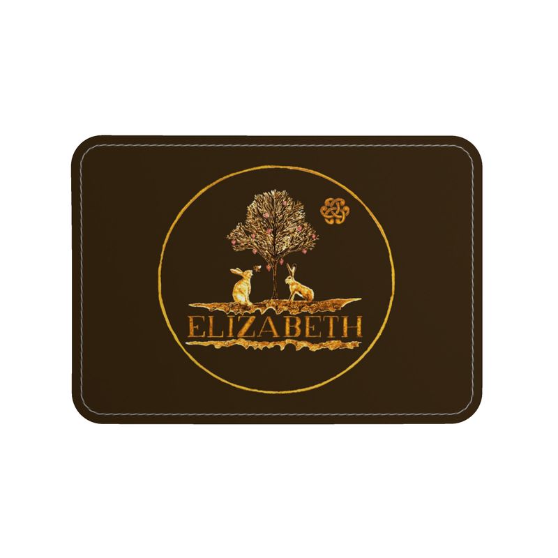 Decorative mat with 'ELIZABETH' and tree design on a brown background