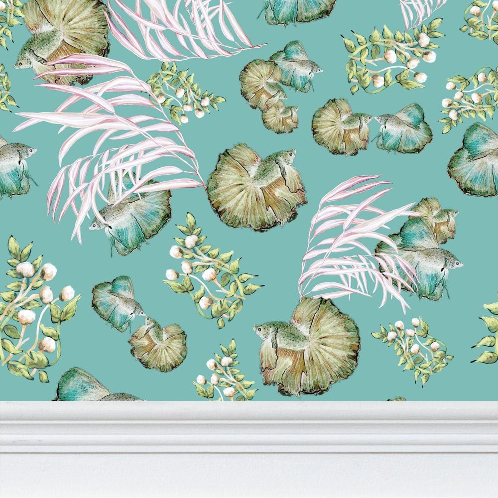 Pattern of green fish and pink flowers on a teal background
