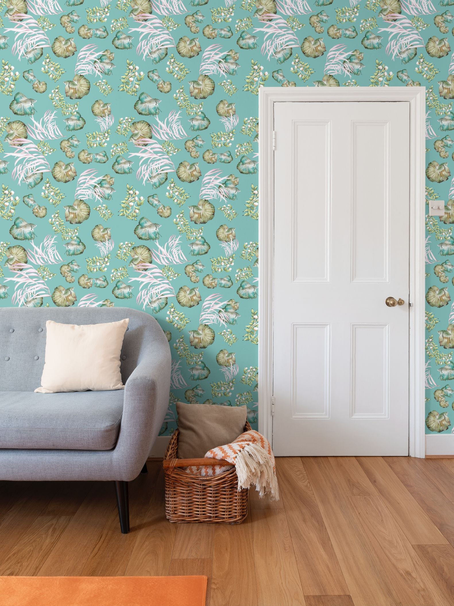 Living room with sea water pond scene fish loral wallpaper, gray sofa, and orange rug.