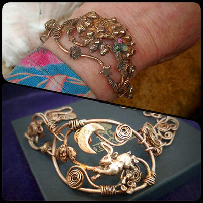Bronze is the new gold bracelet with intricate designs and charms worn on a wrist, and another gold bracelet with a rabbit design on a dark surface by jewellery designer Elizabeth Shewan